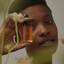 Image of model holding Renew product