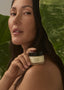 Image of model holding the product restore on their shoulder