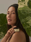 Image of model holding the product restore on their shoulder